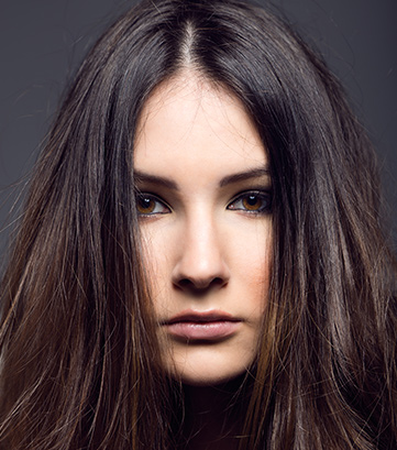  Feathered Layers with Face-Framing Curtain Bangs