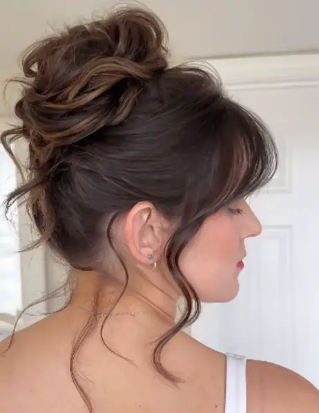 High Bun With Curtain Bangs