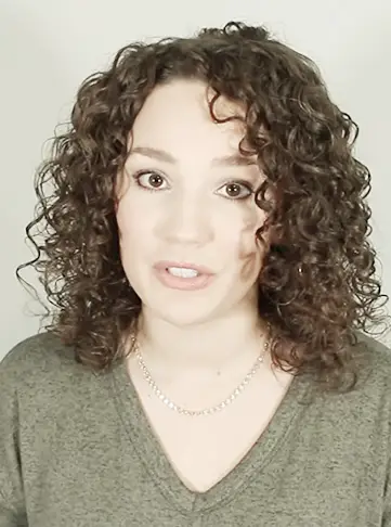 Medium Curly Deep Side Part Hairstyle