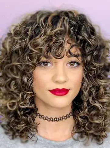 Mid-Length Curly Hairstyle with Curly Bangs