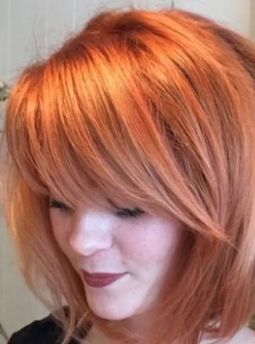 Orange Pixie Blowout Haircut with Bangs and Layers