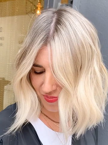 Voluminous Blonde Waves with Subtle Low Lights