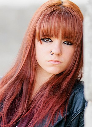 Wolf Cut on Red Hair With Blunt Bangs